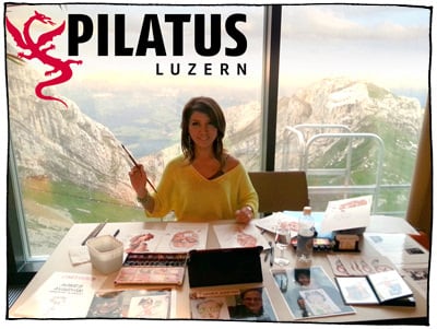 Showkuenstler Agnes im Hotel auf dem Berg Pilatus, Kriens. Aussicht durch das Fenster nach Alpnach. Agnes zeichnet Live-Karikaturen.